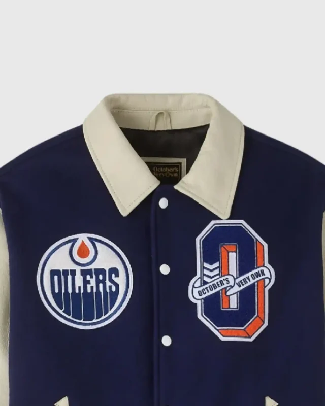 Shop October’s Very Own OVO x NHL Edmonton Oilers Navy Blue Varsity Jacket For Sale